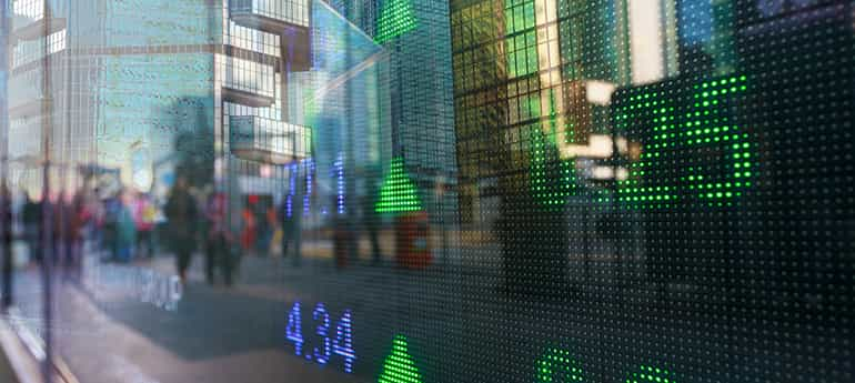 close up image of a digital display showing stock indicators